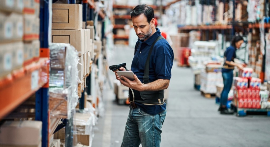 A businessperson analyzing payment methods on a digital tablet