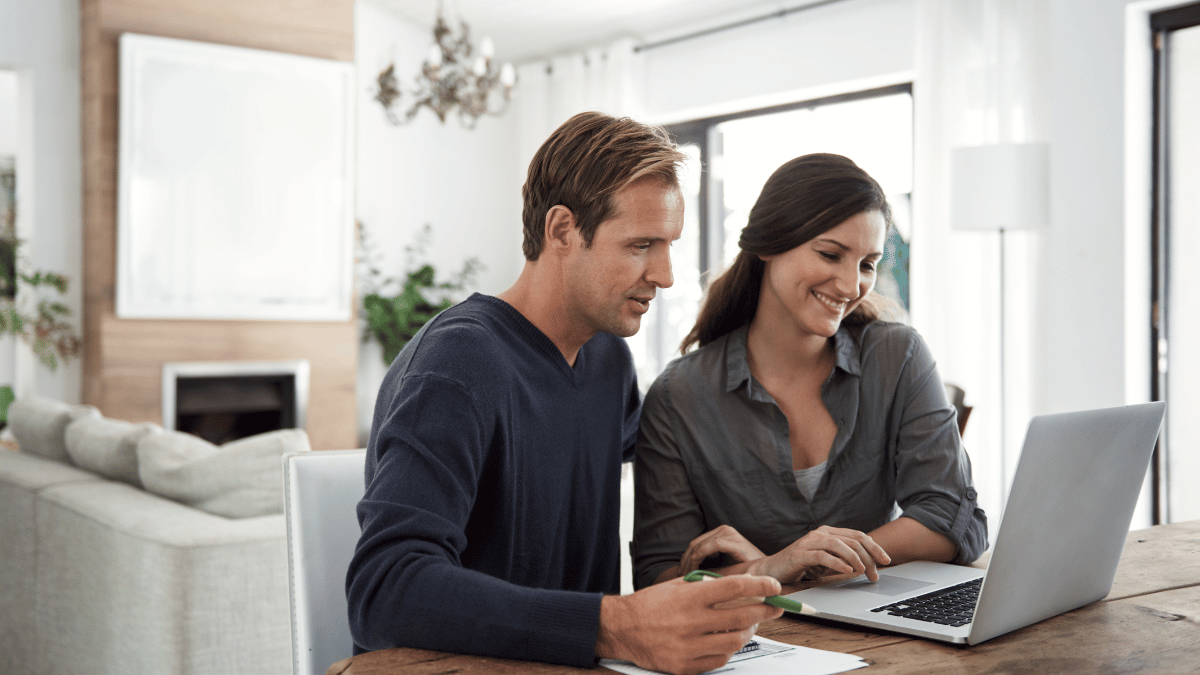 Couple using laptop for banking